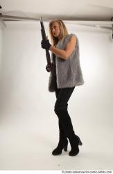 NIKOL STANDING POSE WITH SHOTGUN